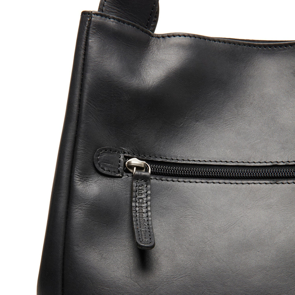 
Fioline Bolso de mano de cuero flor - Vista lateral mostrando el corte ergonómico de mangas