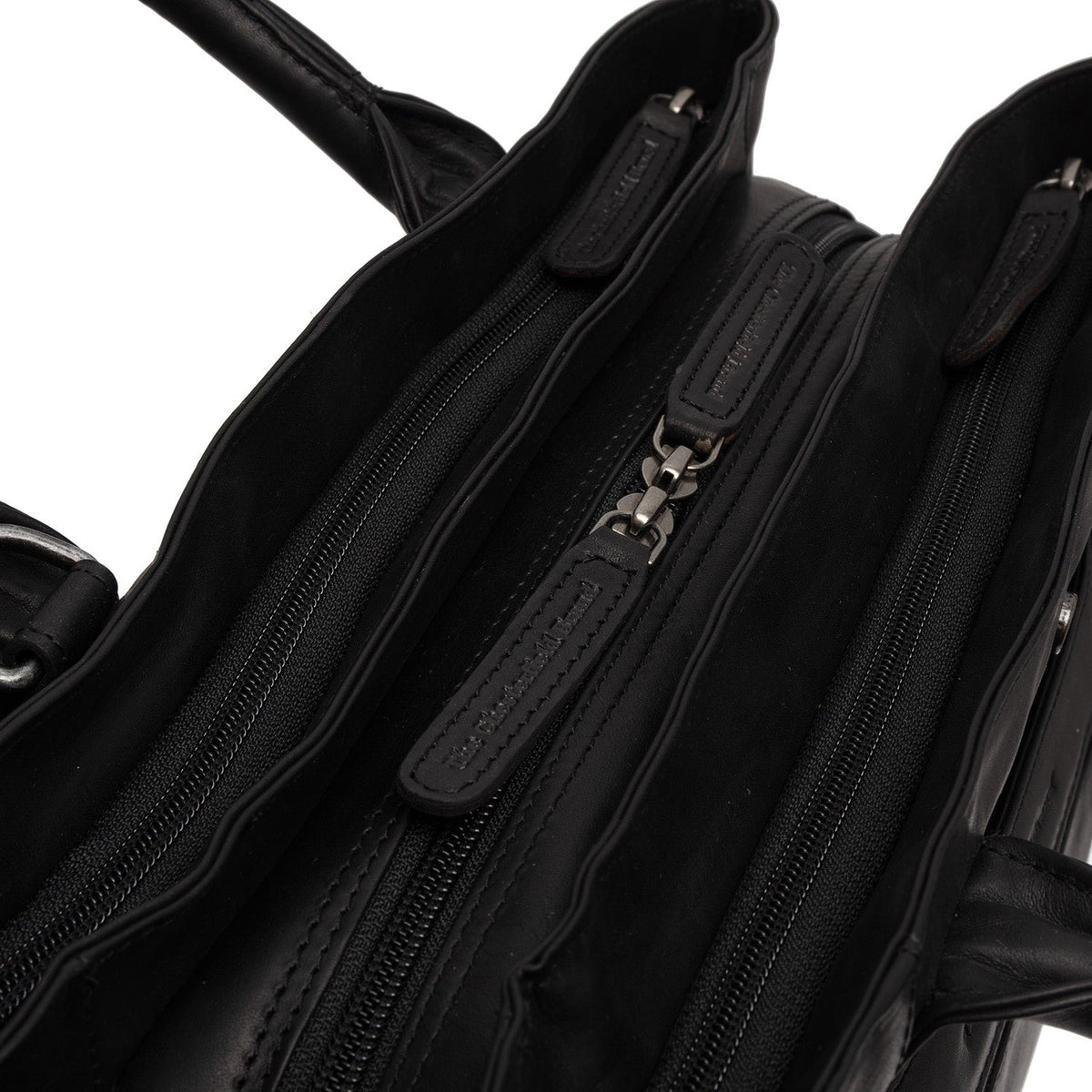
Passau Bolso de mano de cuero flor - Vista lateral mostrando el corte ergonómico de mangas