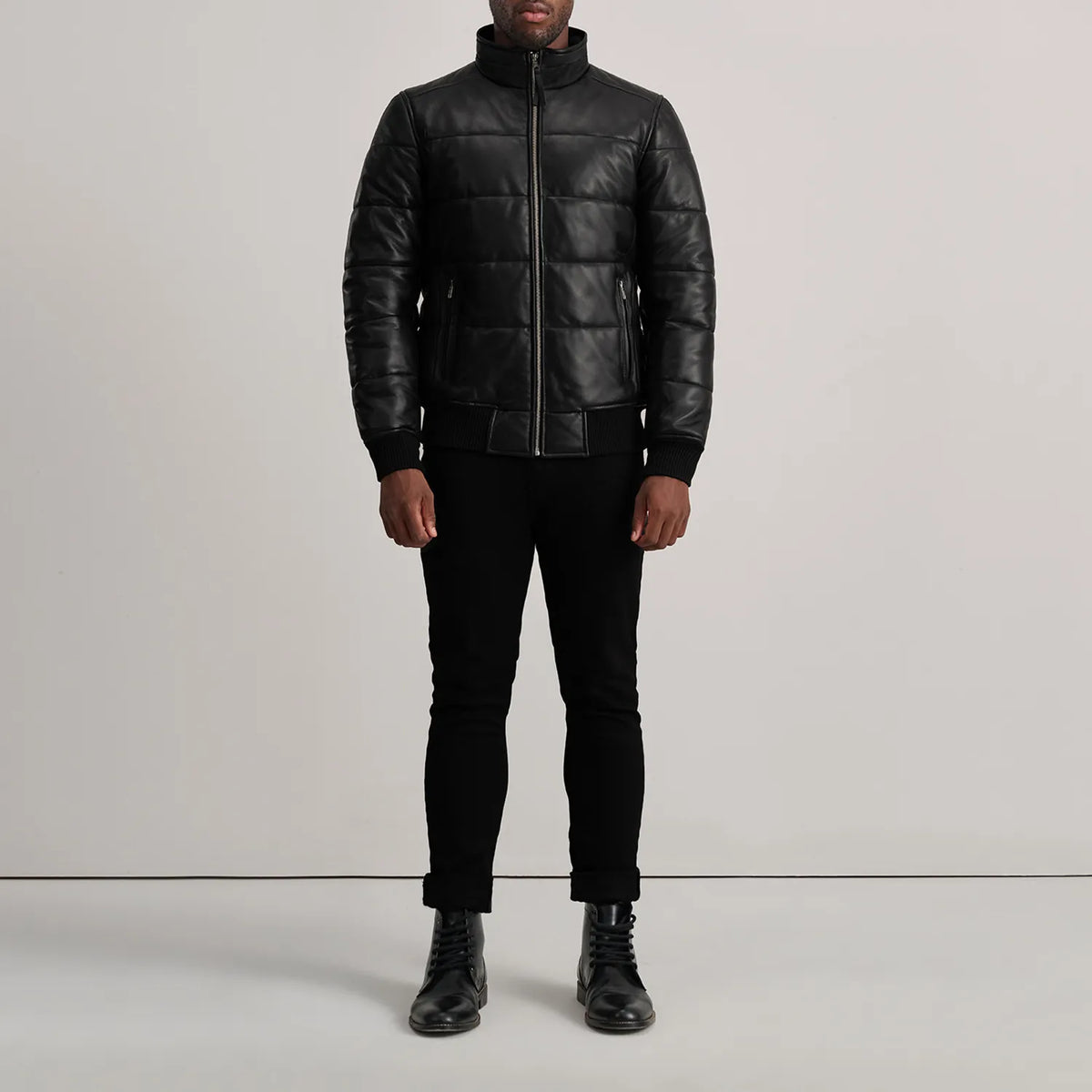 Lucas Blue Leather Puffer Bomber Jacket - Vista de perfil lateral con corte ergonómico de manga